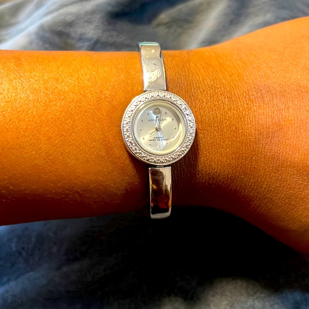 Dainty, elegant yet simple bracelet watch with mother of pearl diamond on face
